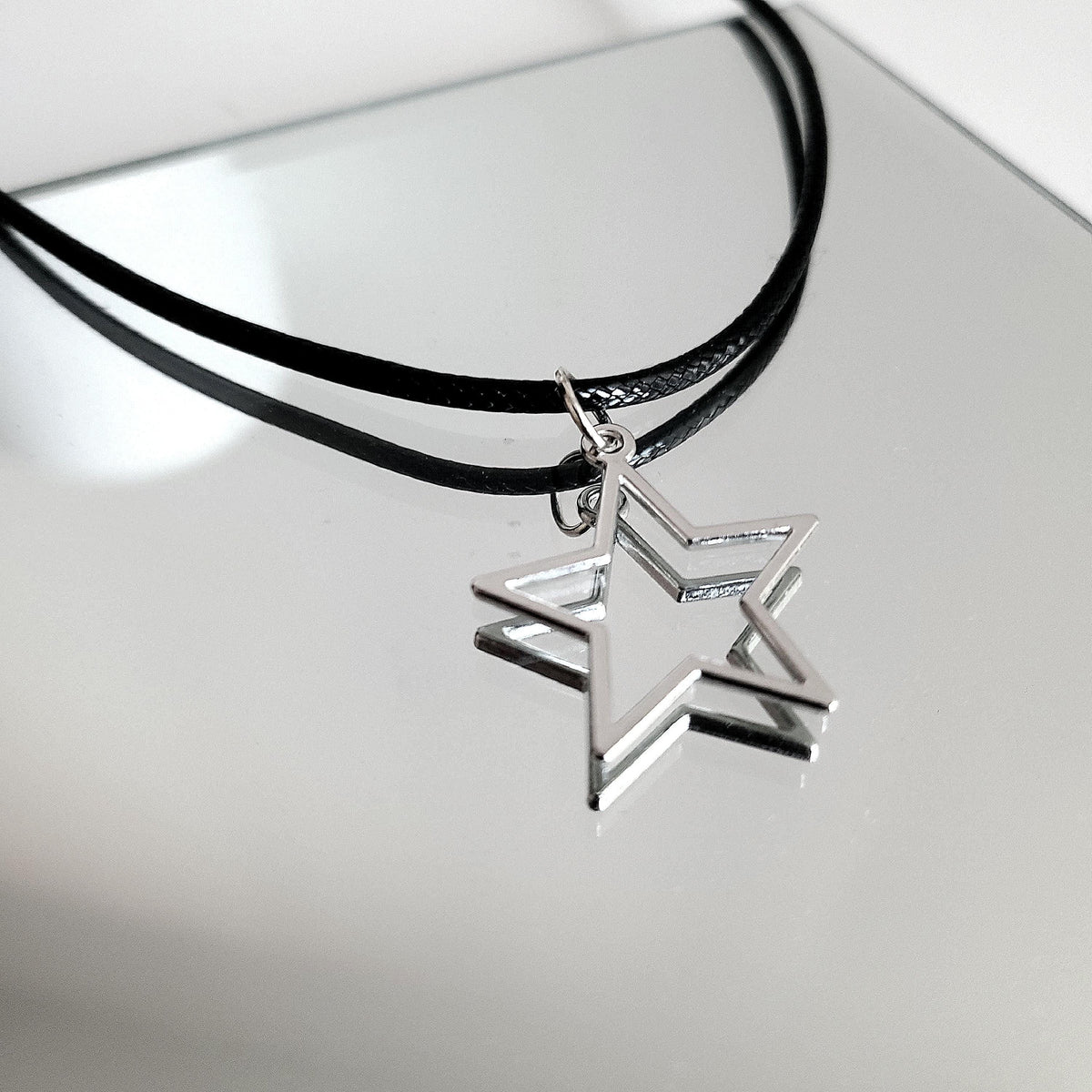 16" Silver Hollow Star Necklace - Black Cord